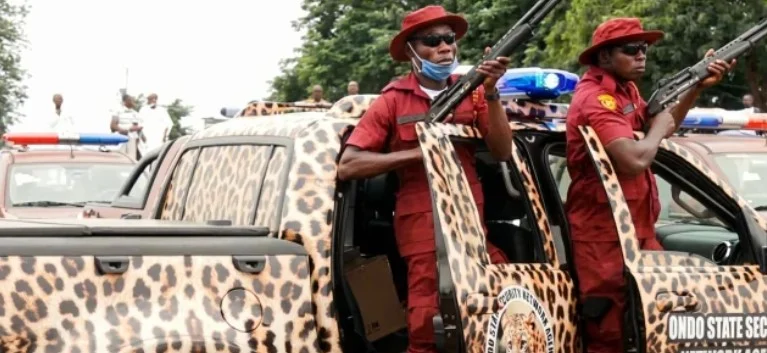 Ondo Amotekun operatives standing by patrol vehicles