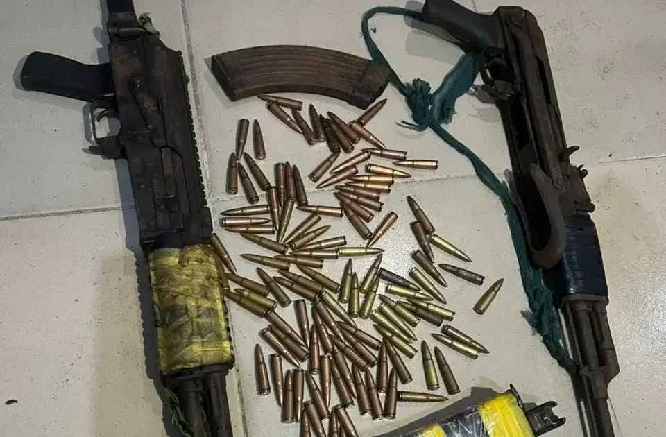 Recovered rifles and ammunition from suspected arms shipment