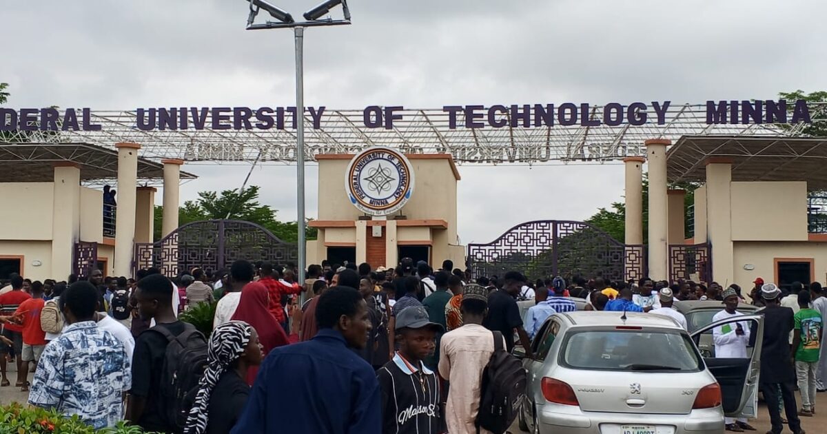Students gathered at the Federal University of Technology Minna gate during a protest