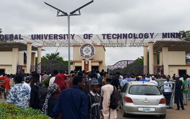 Students gathered at the Federal University of Technology Minna gate during a protest