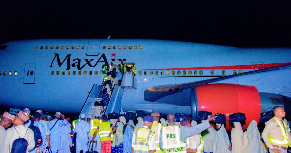 Hajj pilgrims boarding a Max Air aircraft at night. Photo: Premium Times/Katsina State Government