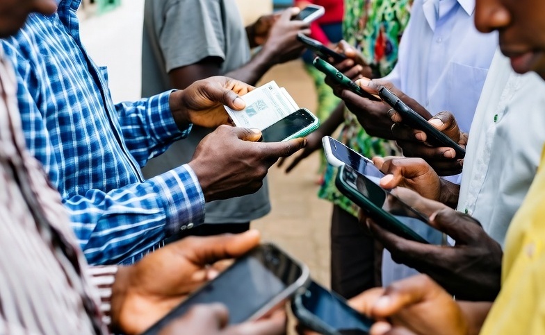 People using mobile phones outdoors