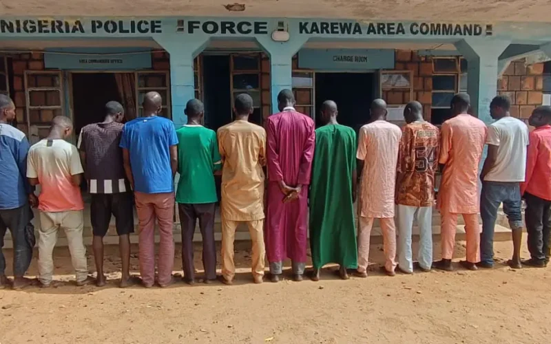 Suspects lined up outside a Nigerian Police Force area command in Adamawa