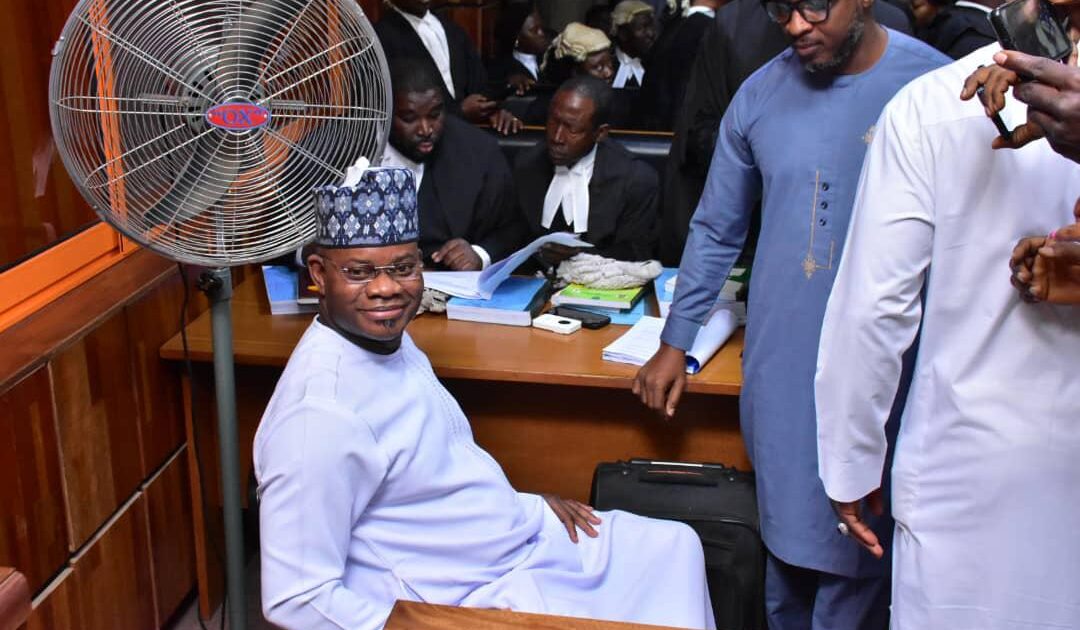 Former Kogi State Governor Yahaya Bello at a Federal High Court session, surrounded by lawyers in legal robes and wigs