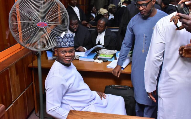 Former Kogi State Governor Yahaya Bello at a Federal High Court session, surrounded by lawyers in legal robes and wigs