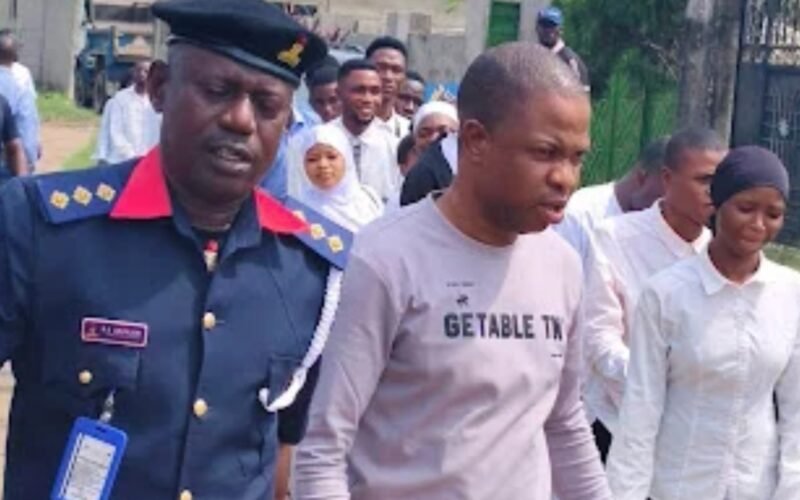 NSCDC officer with rescued youths in Lagos