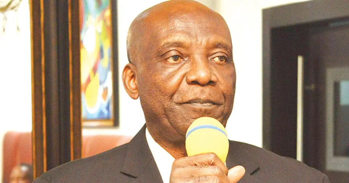 Dennis Amachree speaking into a microphone