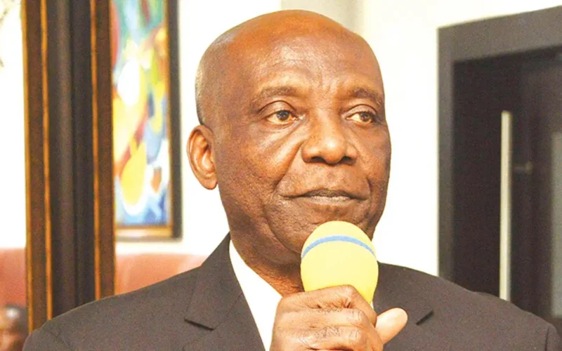 Dennis Amachree speaking into a microphone