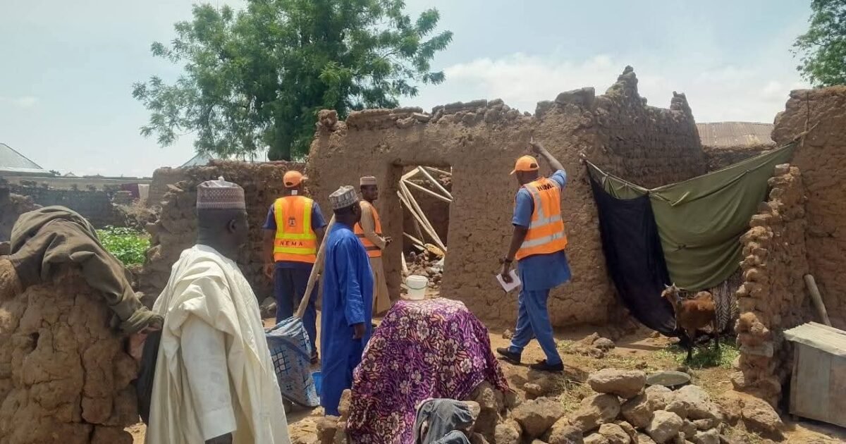 Officials inspect a damaged house scene in Adamawa after the reported lightning strike