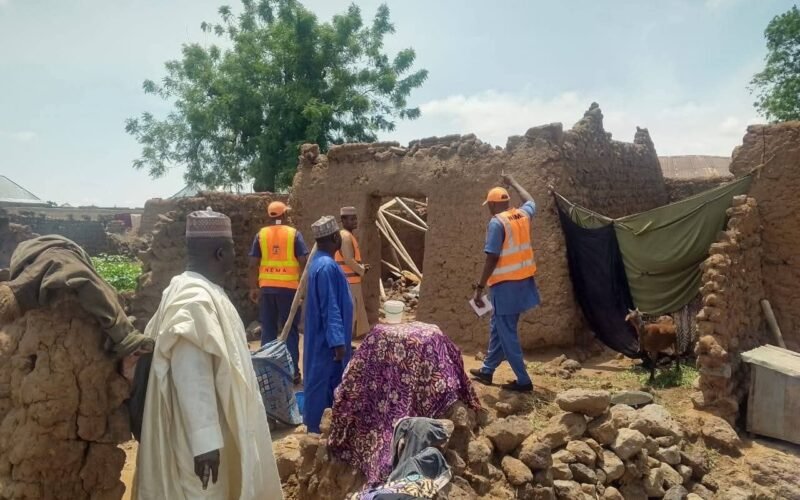 Officials inspect a damaged house scene in Adamawa after the reported lightning strike