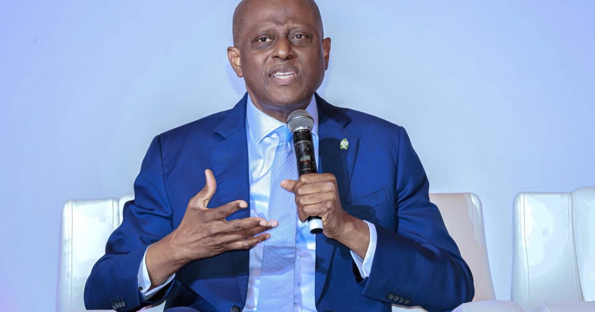 CBN Governor Olayemi Cardoso speaking into a microphone