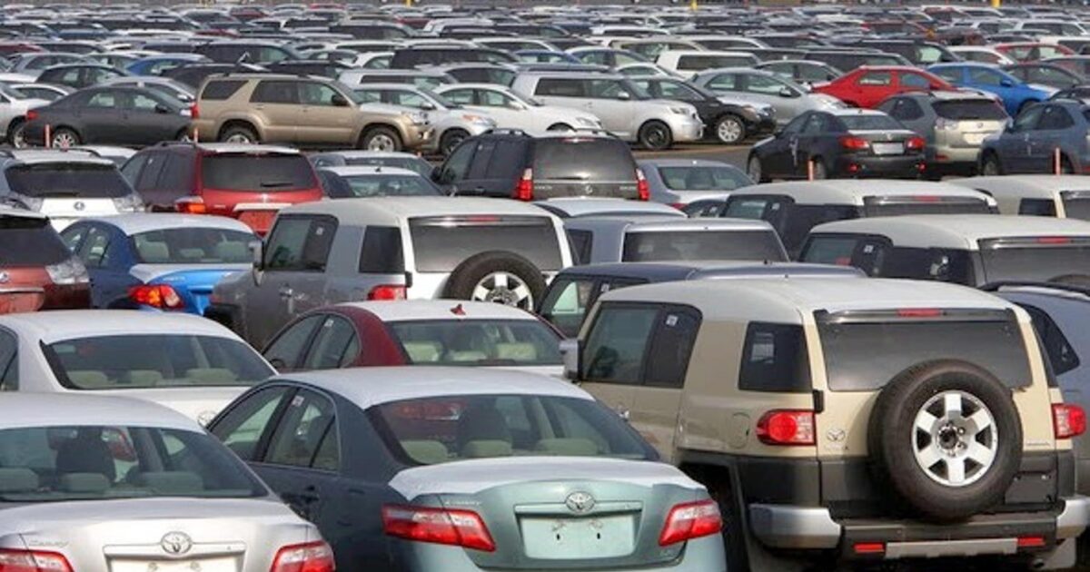 Imported vehicles parked in a large car lot