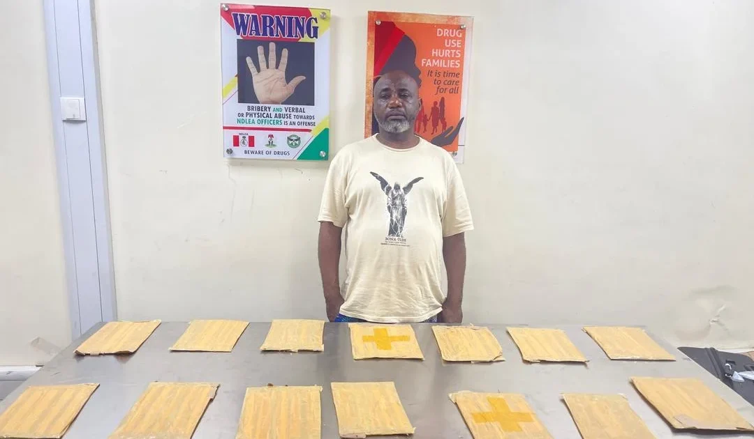 NDLEA cocaine arrest suspect with recovered packages in Lagos