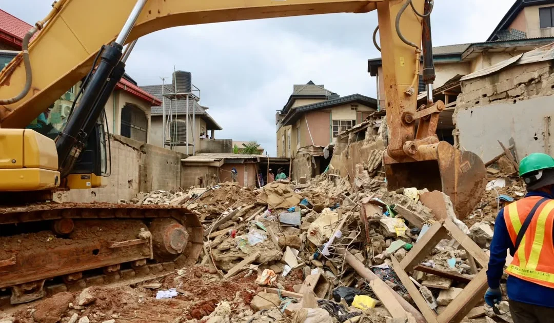 Rubble and excavation equipment at the Ajuwon building collapse scene in Ogun State.