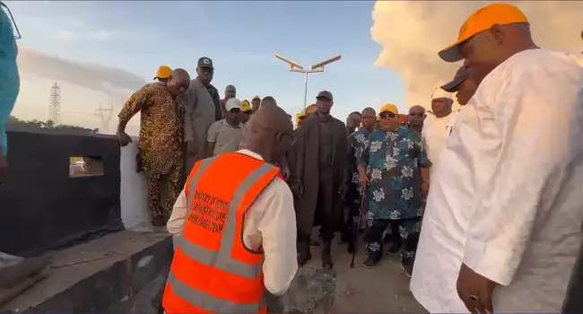 Officials inspecting the Lameco flyover in Osogbo after a reported structural defect