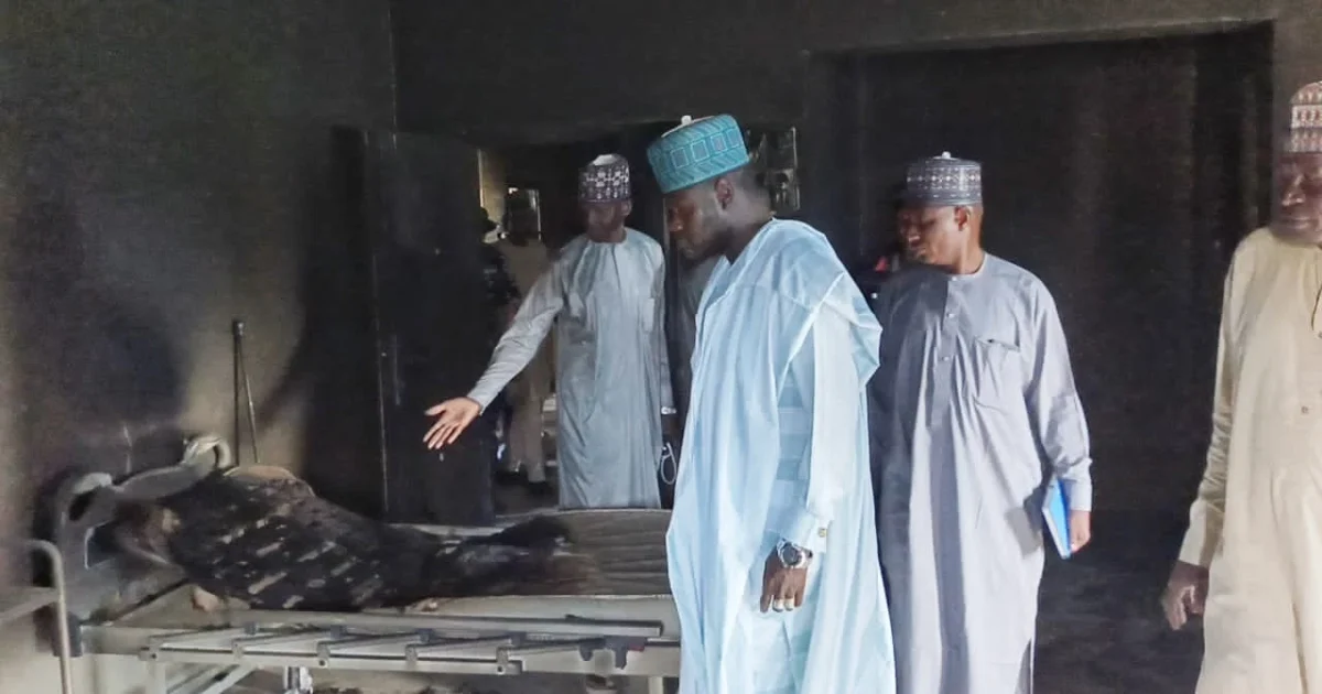 Ngala local government chairman inspecting a burnt facility after an attack in Logomani, Borno