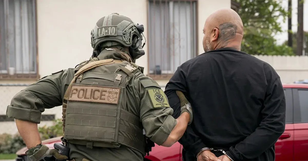 US immigration enforcement officer detaining a man