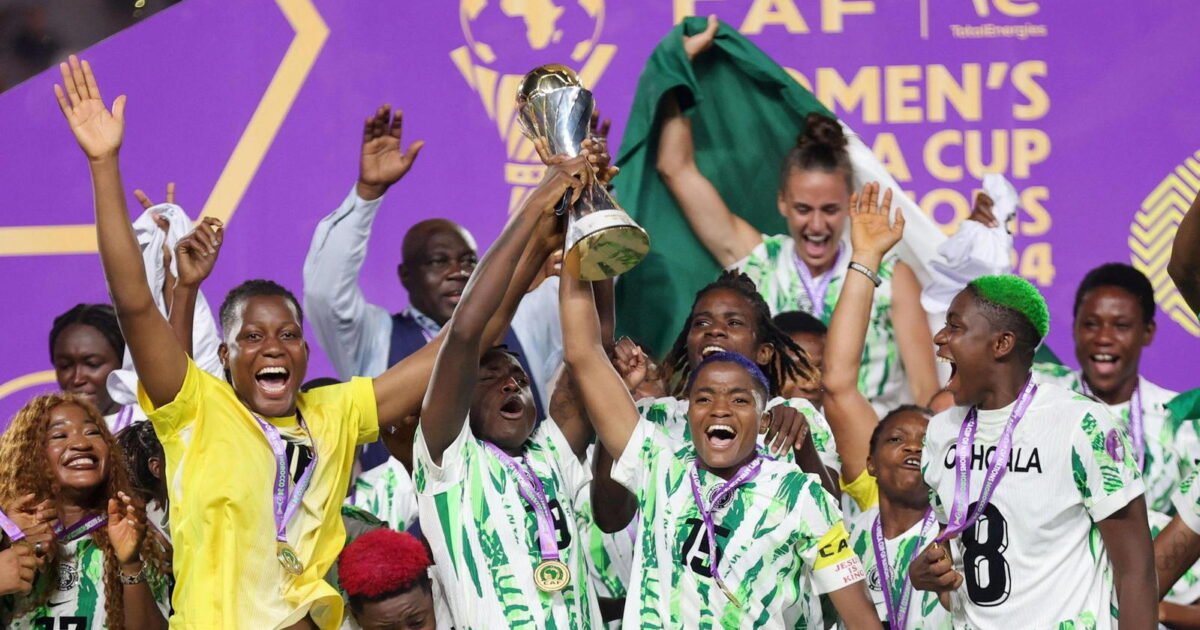 Super Falcons players celebrate with the Women’s Africa Cup of Nations trophy