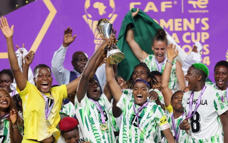 Super Falcons players celebrate with the Women’s Africa Cup of Nations trophy
