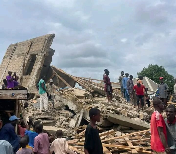 Collapsed building and residents at the Sokoto construction site