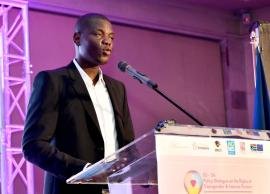 South African International Relations Minister Ronald Lamola speaking at a podium.