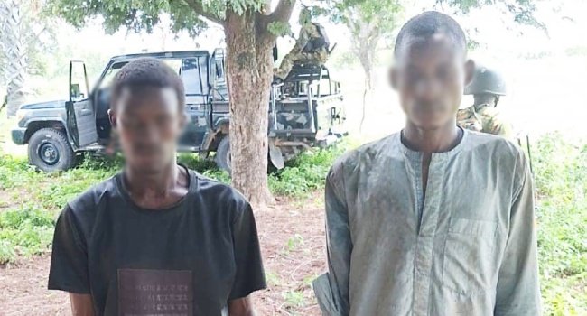 Two kidnapped victims rescued during a Taraba military patrol, with faces blurred.