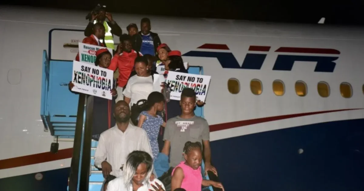 Nigerian returnees disembarking from an Air Peace aircraft after evacuation from South Africa