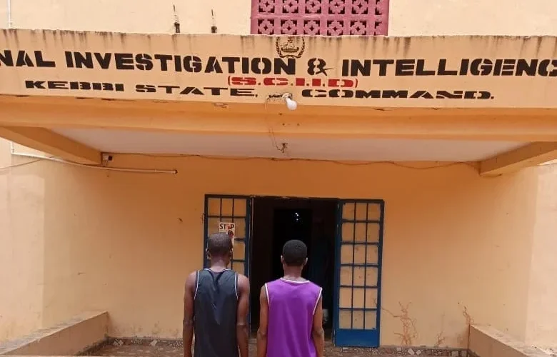 Two suspects outside the Kebbi State Criminal Investigation and Intelligence Department
