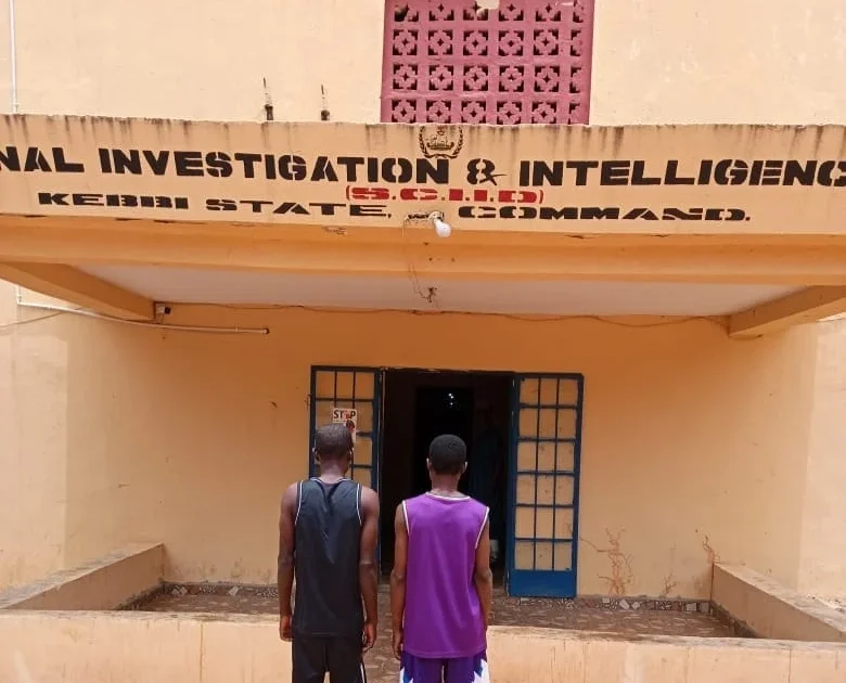 Two suspects outside the Kebbi State Criminal Investigation and Intelligence Department