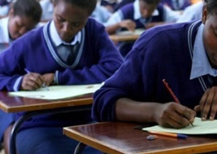 Students sit an examination in a classroom