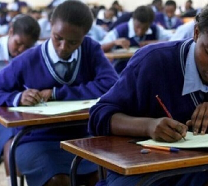 Students sit an examination in a classroom