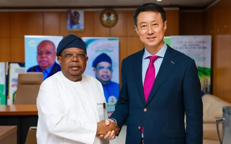 Joseph Tegbe and Chinese Ambassador Yu Dunhai shake hands after Nigeria-China trade talks
