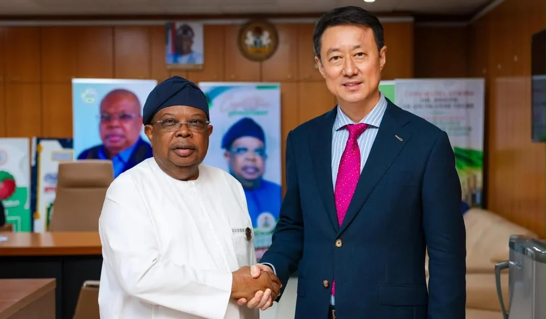 Joseph Tegbe and Chinese Ambassador Yu Dunhai shake hands after Nigeria-China trade talks