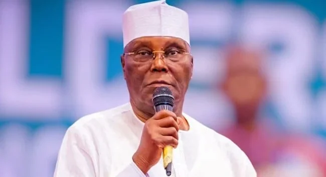 Former Vice President Atiku Abubakar speaking into a microphone