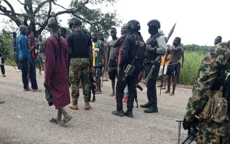 Security personnel and civilians during an Operation Fansan Yamma field operation