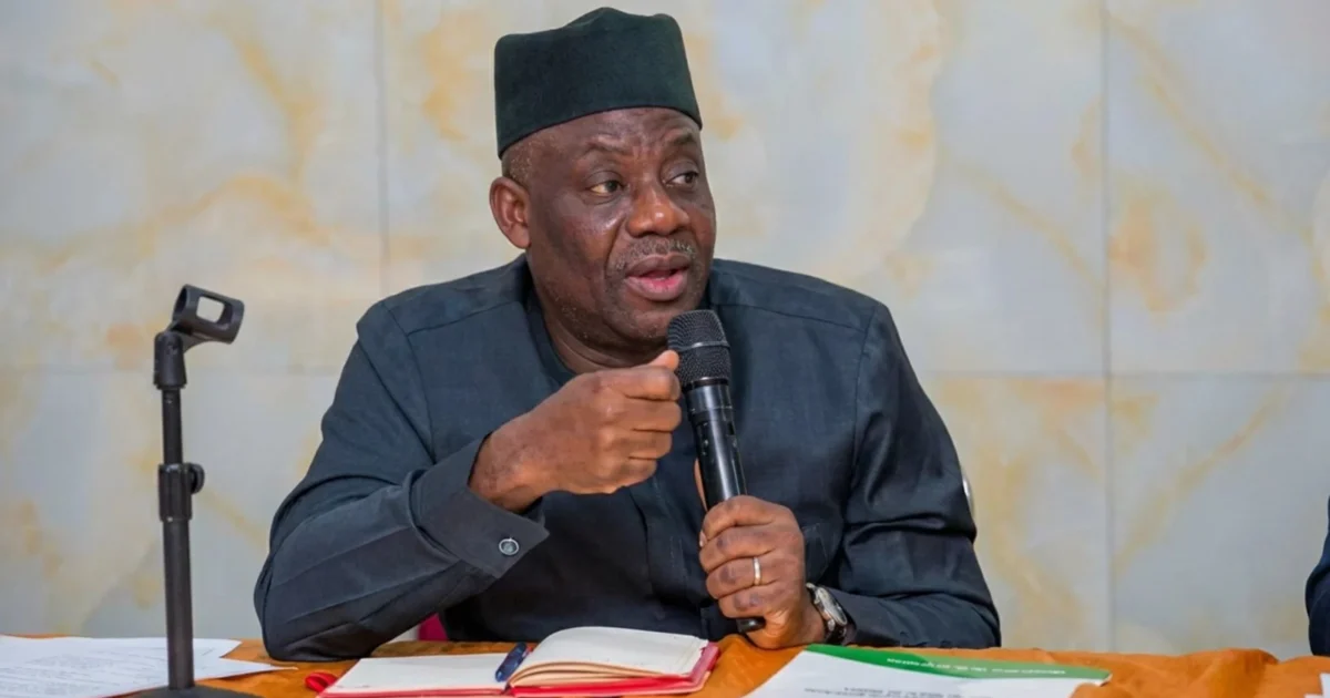 Education Minister Tunji Alausa speaking into a microphone