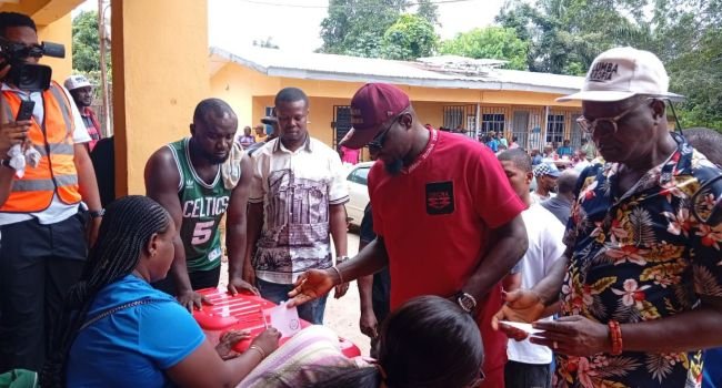 Voters and electoral officials during the Anambra local government election