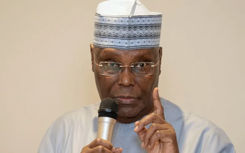 Atiku Abubakar speaking into a microphone