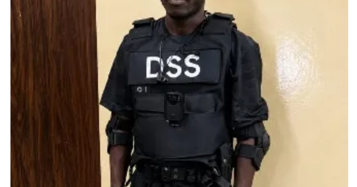 Moferewa Maiye in DSS-marked tactical clothing after his arrest in Abuja