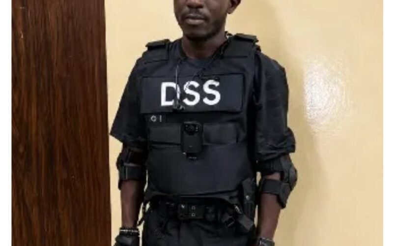 Moferewa Maiye in DSS-marked tactical clothing after his arrest in Abuja
