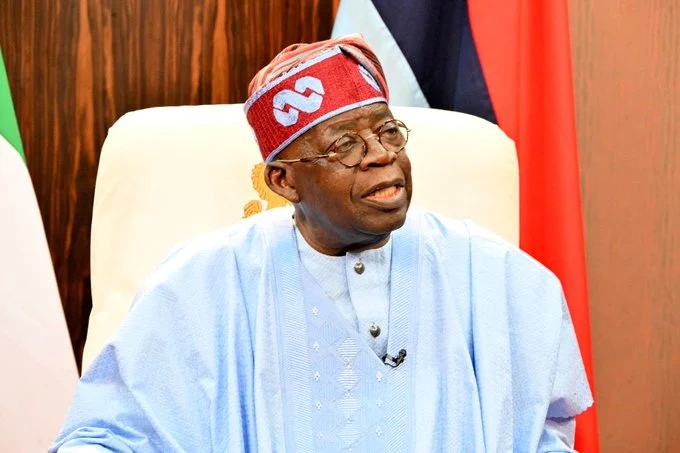 President Bola Tinubu in a blue traditional outfit during an official engagement