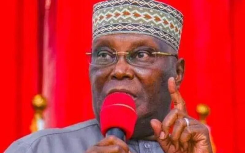 Atiku Abubakar speaking into a microphone at a public event.