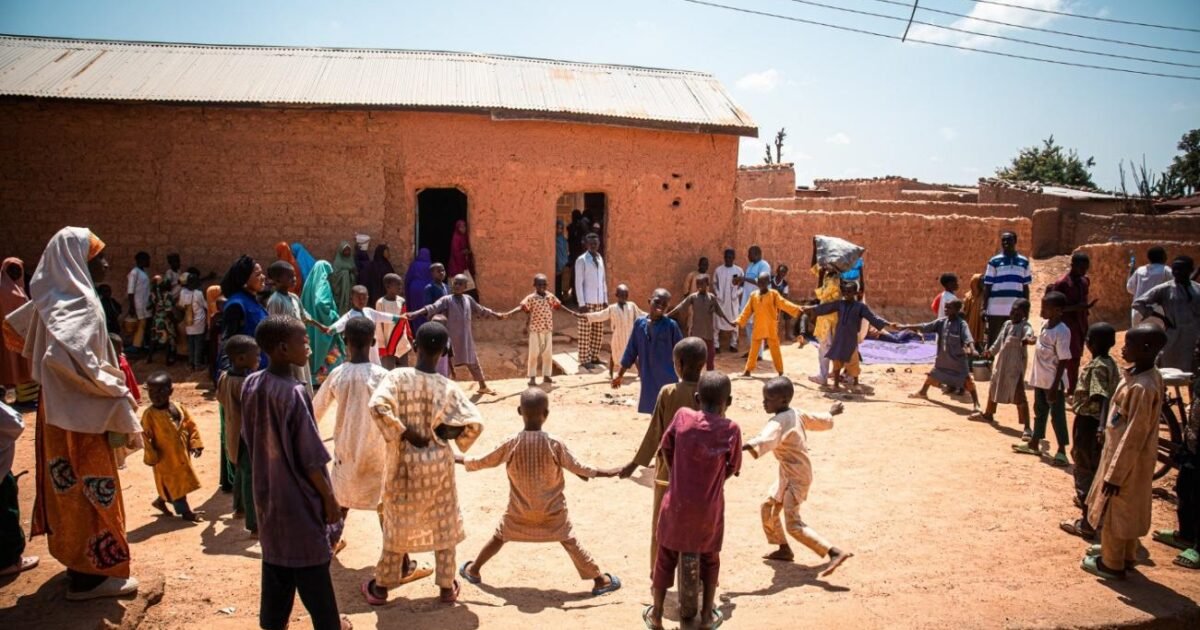 Children take part in an IOM-supported outdoor activity in a conflict-affected community in Katsina State.
