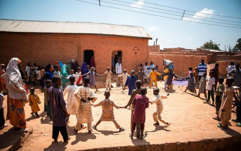 Children take part in an IOM-supported outdoor activity in a conflict-affected community in Katsina State.