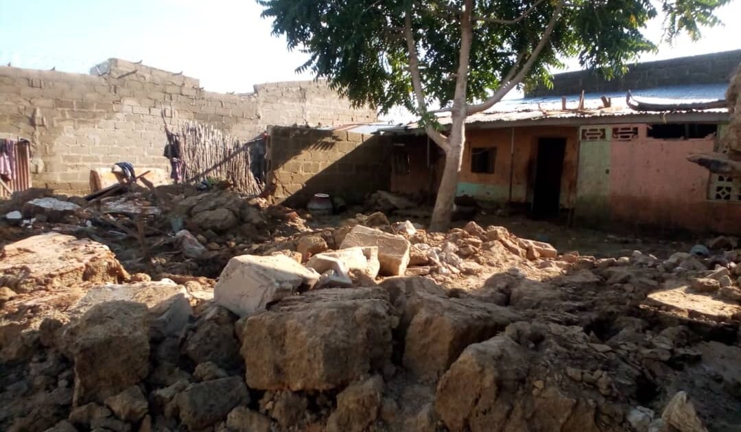 Collapsed mud walls and debris after rain damage in Jigawa