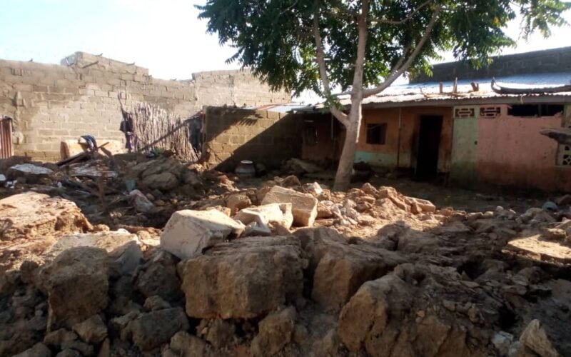 Collapsed mud walls and debris after rain damage in Jigawa