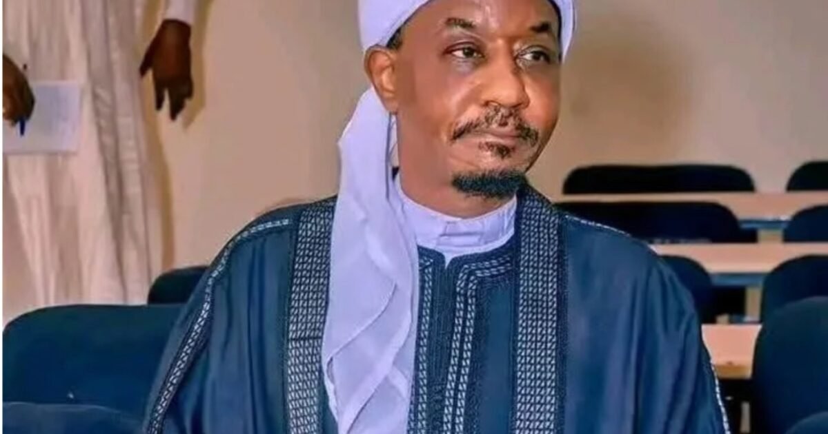 Emir Muhammadu Sanusi II seated in a lecture-room setting.