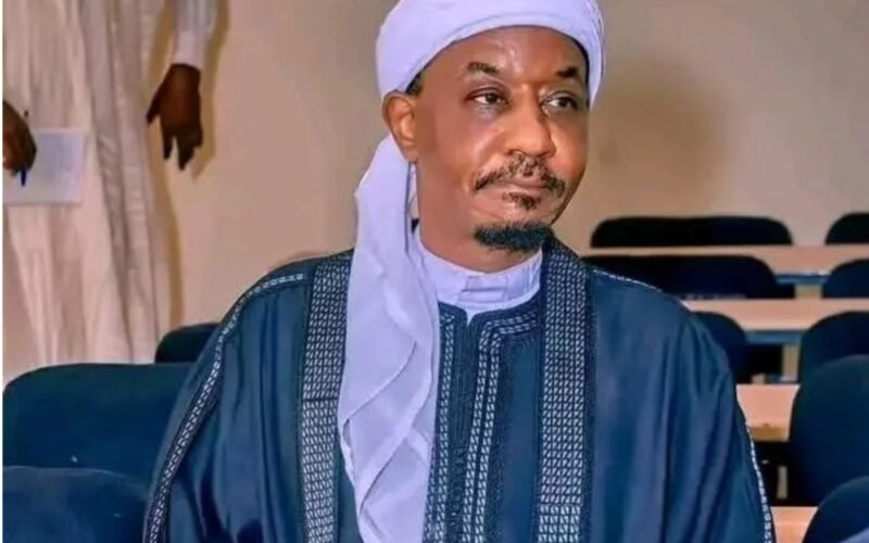 Emir Muhammadu Sanusi II seated in a lecture-room setting.