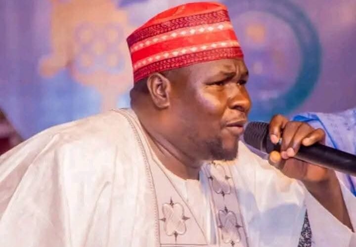 Hausa political singer Kosan Waka performing with a microphone