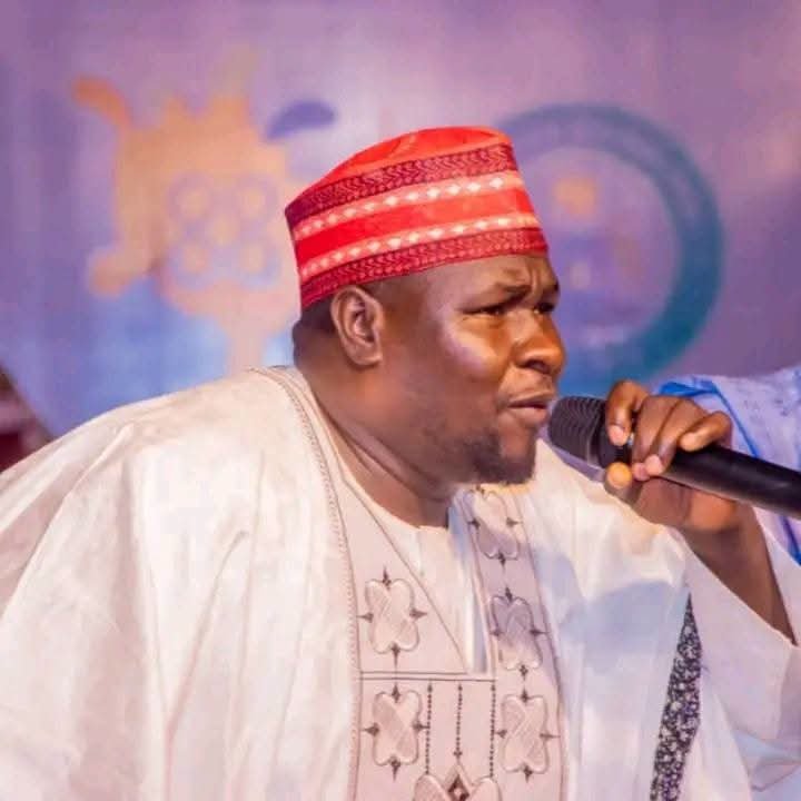 Hausa political singer Kosan Waka performing with a microphone